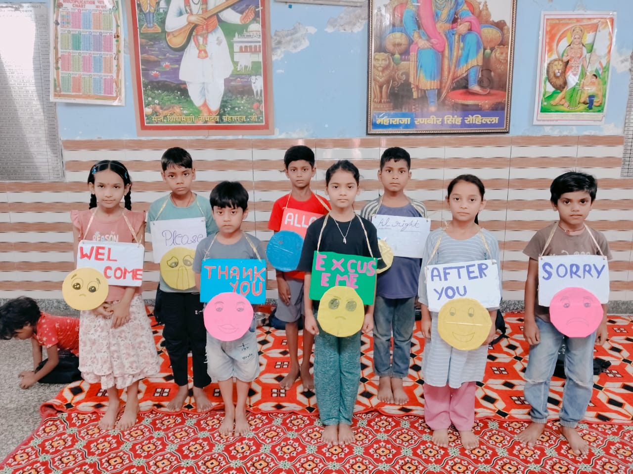 RHSS children smiling and raising their hands during an activity